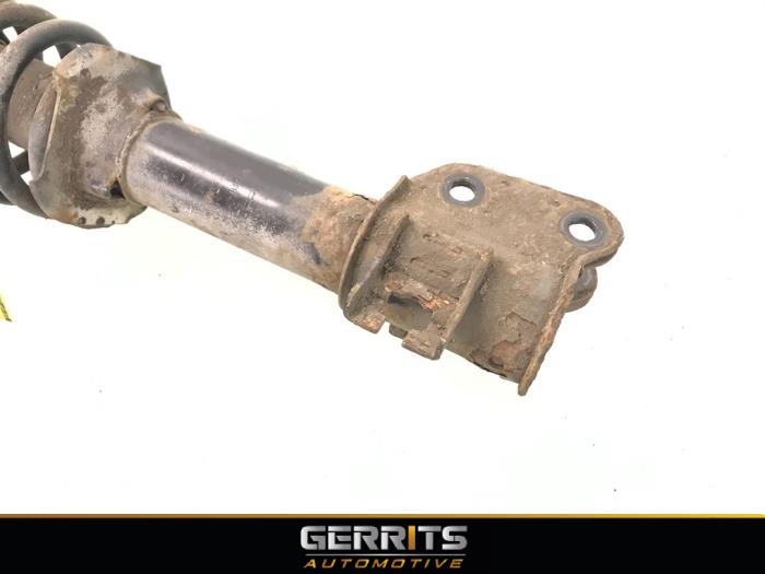 Front shock absorber rod, left from a Suzuki Wagon-R+ (RB) 1.0 12V 2007