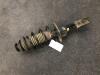 Front shock absorber rod, left from a Toyota Yaris II (P9) 1.33 16V Dual VVT-I 2011