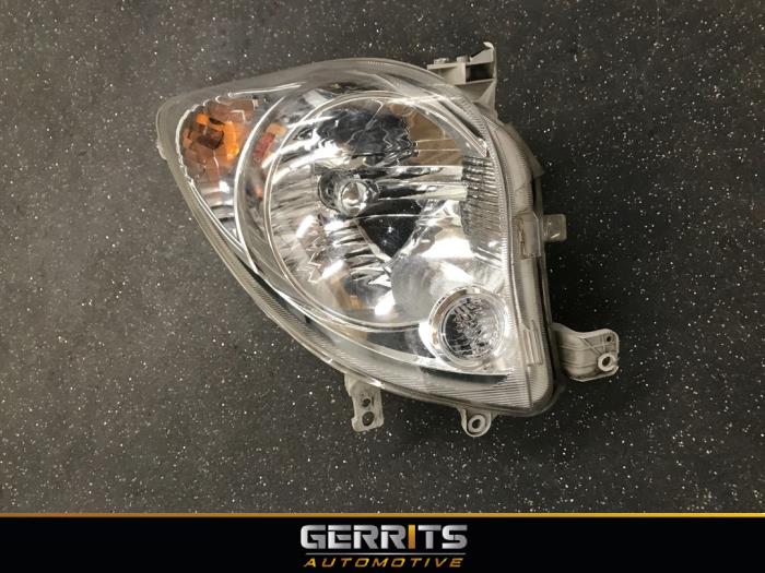 Headlight, right Daihatsu Cuore/Domino 1.0 12V DVVT 10051873 KOITO
