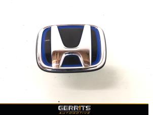 Używane Emblemat Honda Jazz (GR) 1.5 eHEV 16V Cena € 29,99 Procedura marży oferowane przez Gerrits Automotive