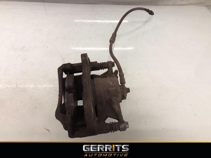 Front brake calliper, left from a Volkswagen Caddy IV 2.0 TDI 102 2016
