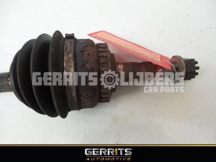Front drive shaft, left from a Opel Vectra B (38) 2.0 Di 16V 1999