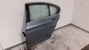 Used Rear door 4-door, left BMW 5 serie (F10) 520d 16V Price on request offered by Autodemontage van de Laar