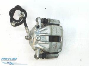 Used Front brake calliper, left Nissan Micra (K14) 1.0 12V Price € 80,00 Margin scheme offered by Autodemontage van de Laar