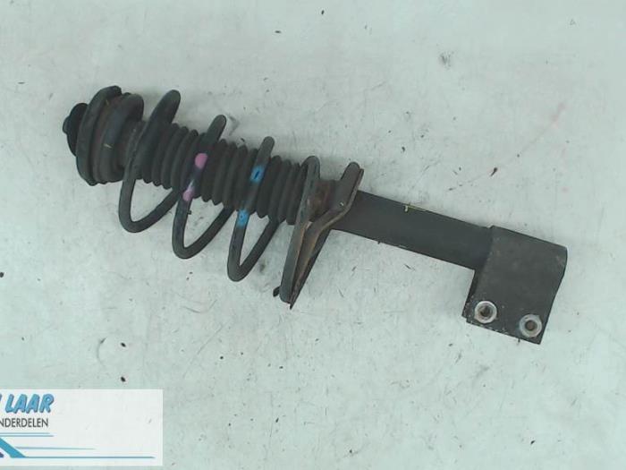 Front shock absorber rod, left from a Peugeot 307 SW (3H) 1.6 16V 2004