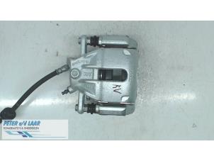 Used Front brake calliper, right Dacia Duster (SR) 1.6 16V Price on request offered by Autodemontage van de Laar