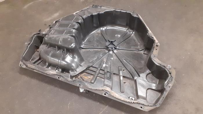 Caja de rueda de repuesto de un Renault Megane III Grandtour (KZ) 1.5 dCi 110 2012