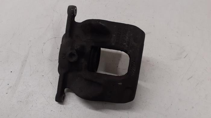 Front brake calliper, left from a Mercedes-Benz A (W176) 1.6 A-180 16V 2014