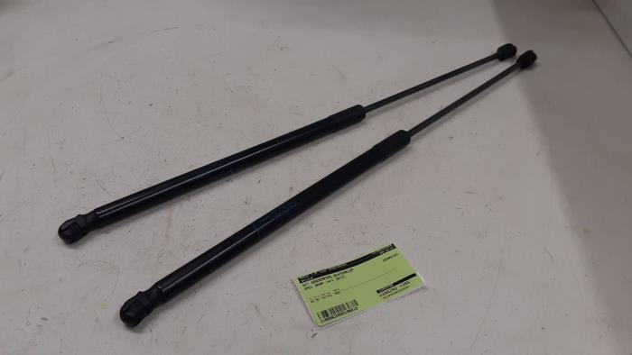 Set of tailgate gas struts from a Opel Adam 1.2 16V 2013