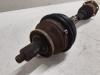 Front drive shaft, left from a Volkswagen Polo IV (9N1/2/3) 1.4 16V 2002
