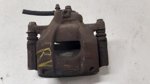 Used Front brake calliper, right Peugeot 107 1.0 12V Price € 40,00 Margin scheme offered by Autodemontage van de Laar