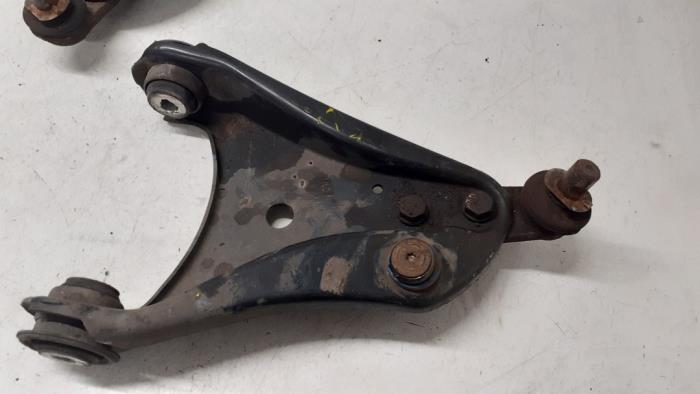 Front wishbone, right from a Renault Twingo II (CN) 1.2 16V 2010