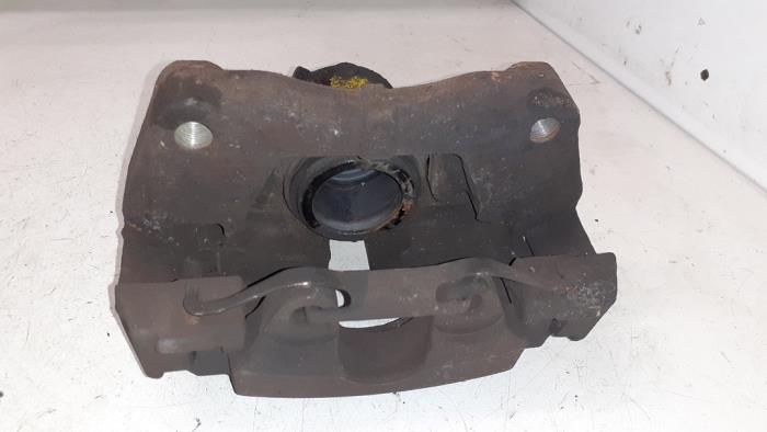 Front brake calliper, left from a Volkswagen Transporter T5 2.0 TDI DRF 2012