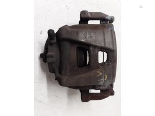 Used Front brake calliper, left Volkswagen Tiguan (5N1/2) 1.4 TSI 16V Price on request offered by Autodemontage van de Laar