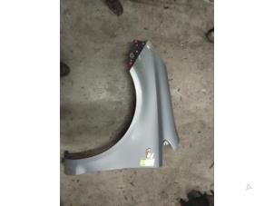 Used Front wing, left Opel Corsa D 1.4 16V Twinport Price on request offered by Autodemontage van de Laar