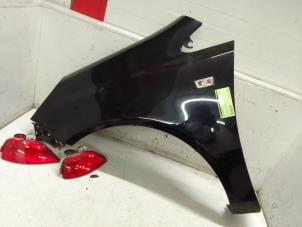 Used Front wing, left Opel Corsa D 1.2 16V Price on request offered by Autodemontage van de Laar