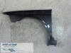 Front wing, left from a Renault Laguna II Grandtour (KG) 1.9 dCi 120 2003
