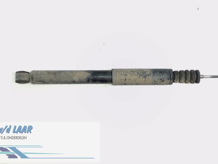 Rear shock absorber, left from a Renault Clio III (BR/CR) 1.2 16V TCe 100 2008