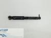 Rear shock absorber, left from a Renault Scénic II (JM), 2003 / 2009 2.0 16V, MPV, Petrol, 1.998cc, 99kW (135pk), FWD, F4R770; EURO4; F4R771, 2003-06 / 2009-06 2005