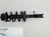 Front shock absorber rod, left from a Dacia Logan MCV (KS), 2007 / 2013 1.6 16V Flexifuel, Combi/o, 1.598cc, 77kW (105pk), FWD, K4M690; K4M694, 2009-11 / 2013-05 2011