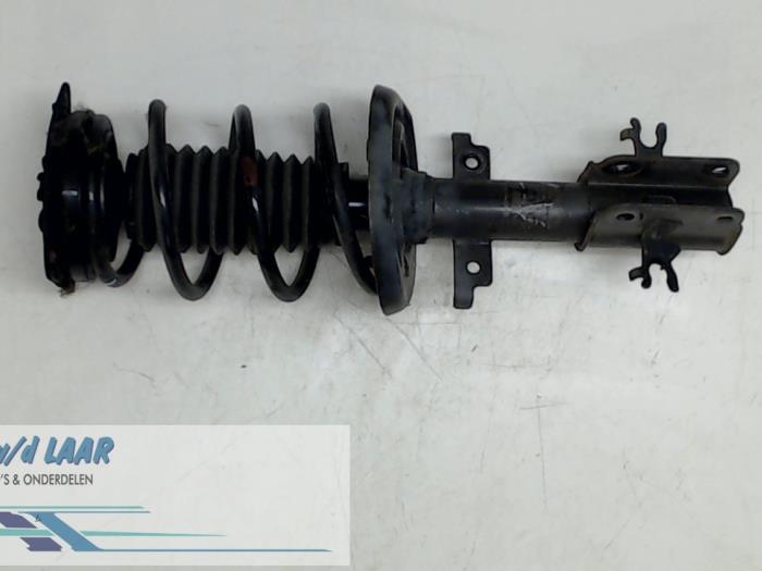 Front shock absorber rod, left from a Renault Laguna III Estate (KT) 1.5 dCi 110 2010