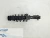 Front shock absorber rod, left from a Volkswagen Golf 1998