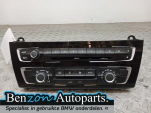 Used Radio control panel BMW 3-Serie Price € 181,50 Inclusive VAT offered by Benzon Autodemontage