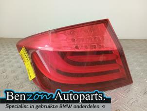 Used Taillight, left BMW 5 serie (F10) 520d 16V Price on request offered by Benzon Autodemontage