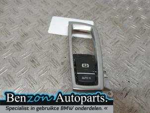 Used Parking brake switch BMW 5 serie Touring (F11) 520d 16V Price on request offered by Benzon Autodemontage