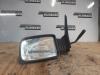 Wing mirror, left from a Peugeot 205 I (741A/C), 1983 / 1987 1.0,L,XE, Hatchback, Petrol, 954cc, 33kW (45pk), FWD, XV8; 108C, 1983-02 / 1987-10 1983
