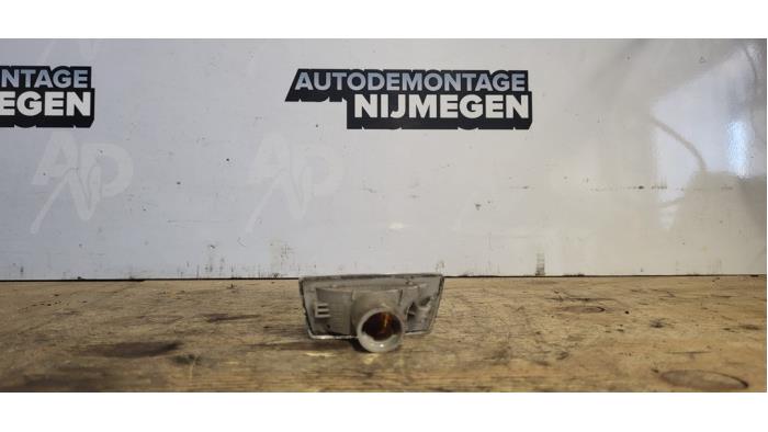 Indicator lens, front left from a Opel Corsa D 1.2 16V 2011