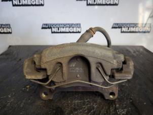 Used Front brake calliper, left Seat Leon (1P1) 2.0 TDI 16V FR Price on request offered by Autodemontage Nijmegen