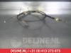 Parking brake cable from a Toyota Yaris II (P9), 2005 / 2014 1.4 D-4D, Hatchback, Diesel, 1.364cc, 66kW (90pk), FWD, 1NDTV, 2005-08 / 2012-12, NLP90 2007