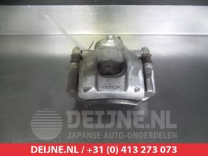 Used Front brake calliper, left Toyota Aygo (B40) Price € 20,00 Margin scheme offered by V.Deijne Jap.Auto-onderdelen BV