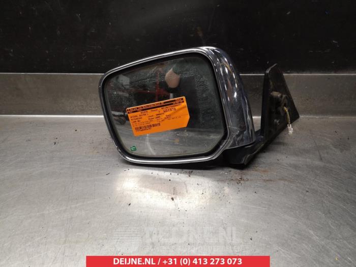 Wing mirror, left from a Mitsubishi L-200  2005