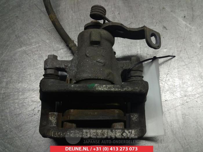 Rear brake calliper, left from a Kia Cee'd Sportswagon (JDC5) 1.6 GDI 16V 2014