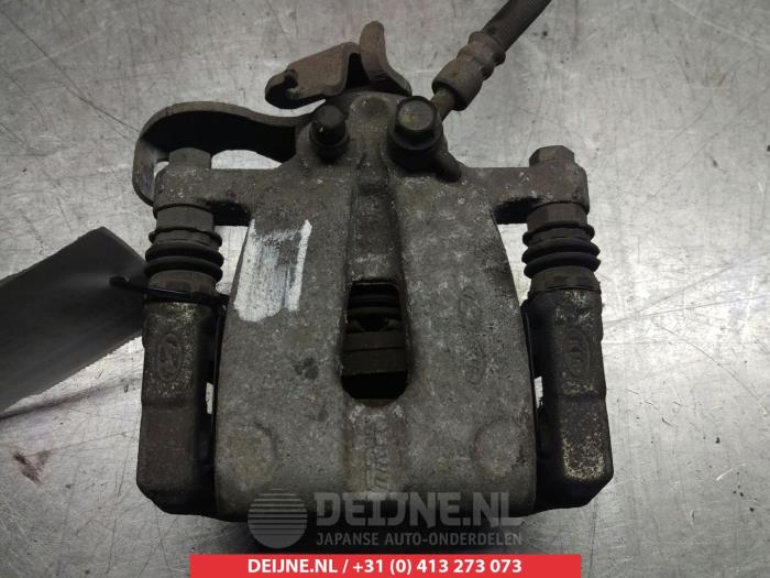 Rear brake calliper, left from a Kia Cee'd Sportswagon (JDC5) 1.6 GDI 16V 2014