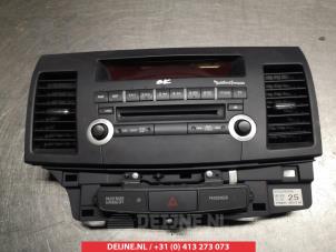 Used Radio control panel Mitsubishi Lancer Sports Sedan (CY/CZ) 1.8 MIVEC 16V Price on request offered by V.Deijne Jap.Auto-onderdelen BV