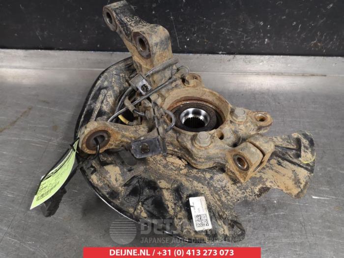 Knuckle, front left from a Kia Sportage (QL) 1.6 T-GDI 16V 4x2 2019