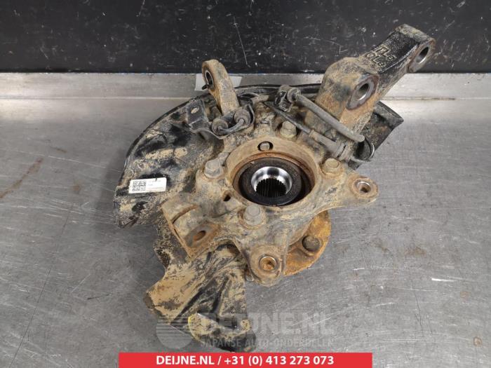 Knuckle, front left from a Kia Sportage (QL) 1.6 T-GDI 16V 4x2 2019