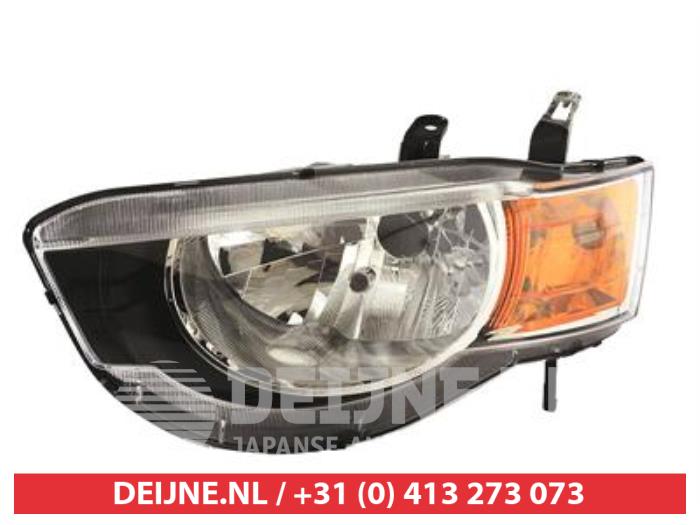 Headlight, left from a Mitsubishi Colt 2009