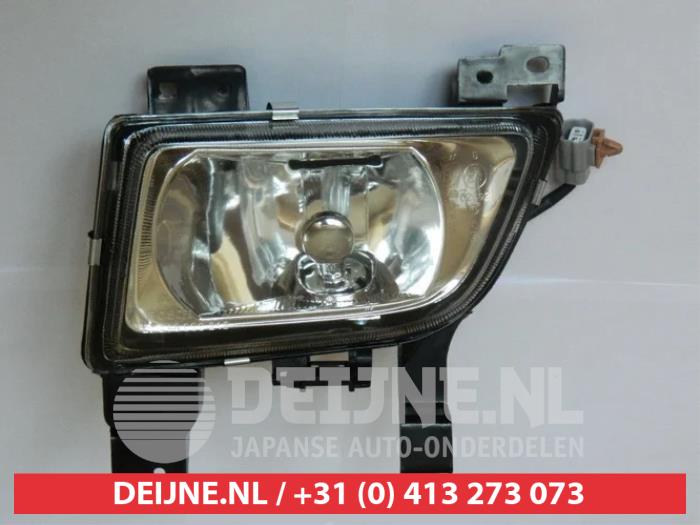 Fog light, front left from a Mazda 323 2001