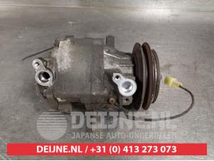 Used Air conditioning pump Daihatsu Cuore (L251/271/276) 1.0 12V DVVT Price € 35,00 Margin scheme offered by V.Deijne Jap.Auto-onderdelen BV