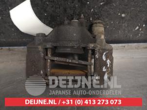 Used Front brake calliper, left Mazda Demio (DW) 1.3 16V Price € 35,00 Margin scheme offered by V.Deijne Jap.Auto-onderdelen BV