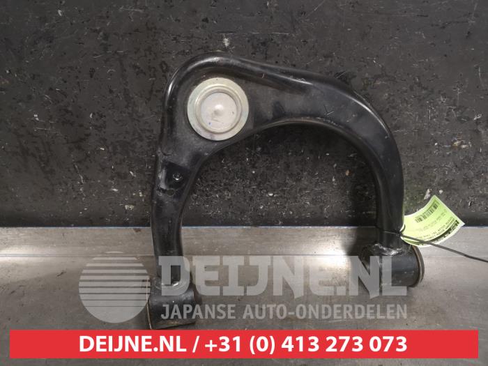 Front upper wishbone, left from a Toyota Hilux VI 2.4 D4D-F 16V 4x4 2018