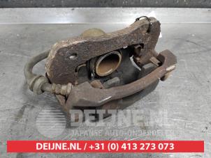 Used Front brake calliper, left Kia Carens II (FJ) 2.0i CVVT 16V Price € 35,00 Margin scheme offered by V.Deijne Jap.Auto-onderdelen BV