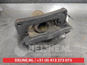Used Front brake calliper, left Subaru Legacy Wagon (BH) 2.0 16V Price € 30,00 Margin scheme offered by V.Deijne Jap.Auto-onderdelen BV