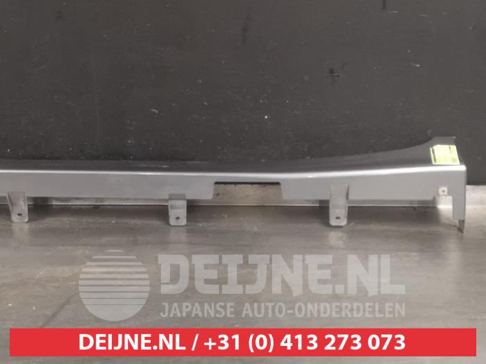 Side skirt, left from a Nissan Note (E12) 1.2 DIG-S 98 2016