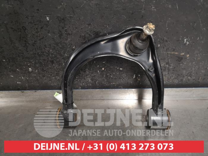 Front upper wishbone, left from a Toyota Hilux VI 2.4 D4D-F 16V 4x4 2022