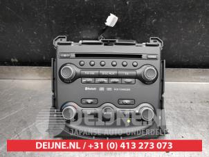 Usados Panel de control de radio Nissan 370 Z (Z34A) 3.7 V6 24V VVEL Precio de solicitud ofrecido por V.Deijne Jap.Auto-onderdelen BV